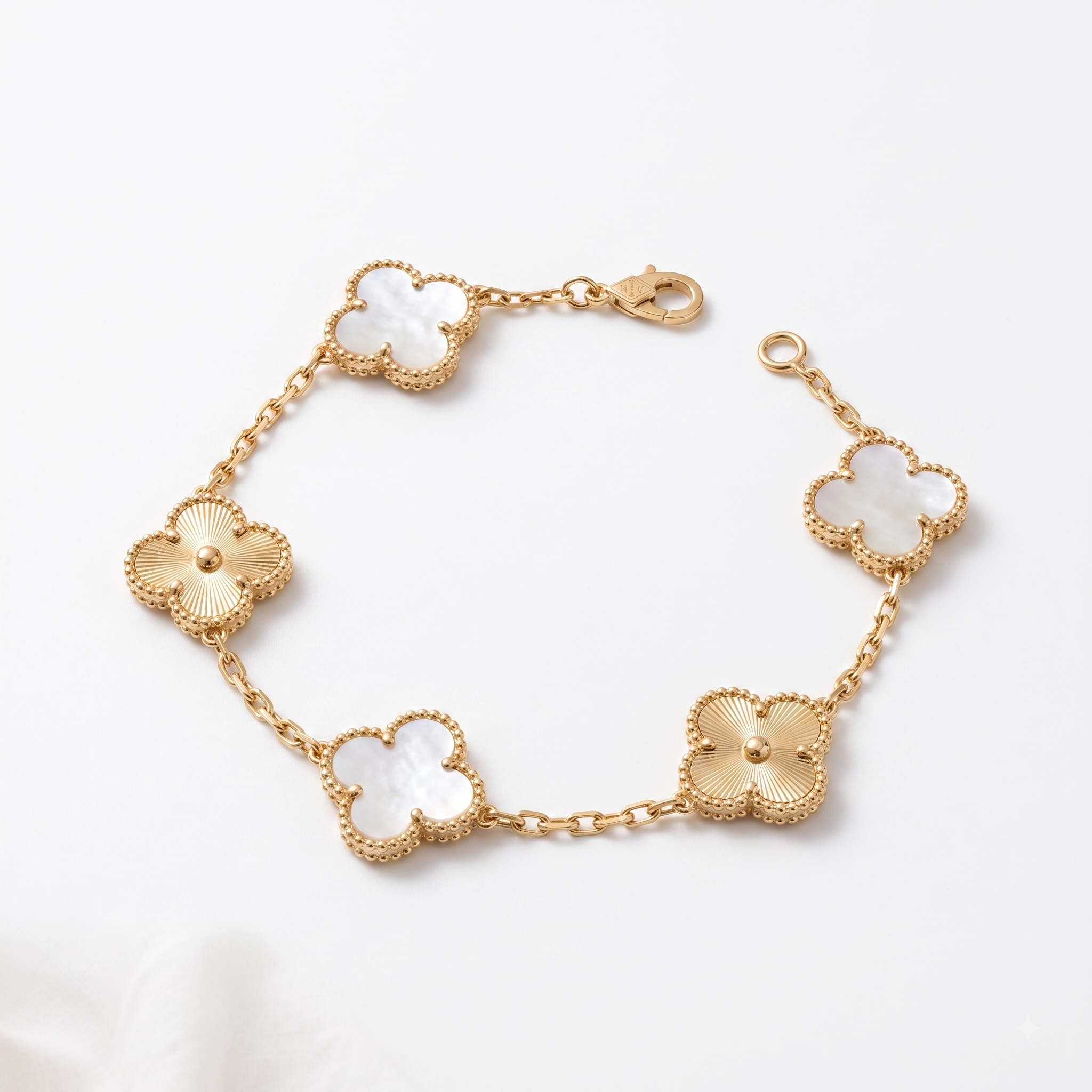 White & gold mother-of-pearl Lucky Clover Station Bracelet, close-up product shot