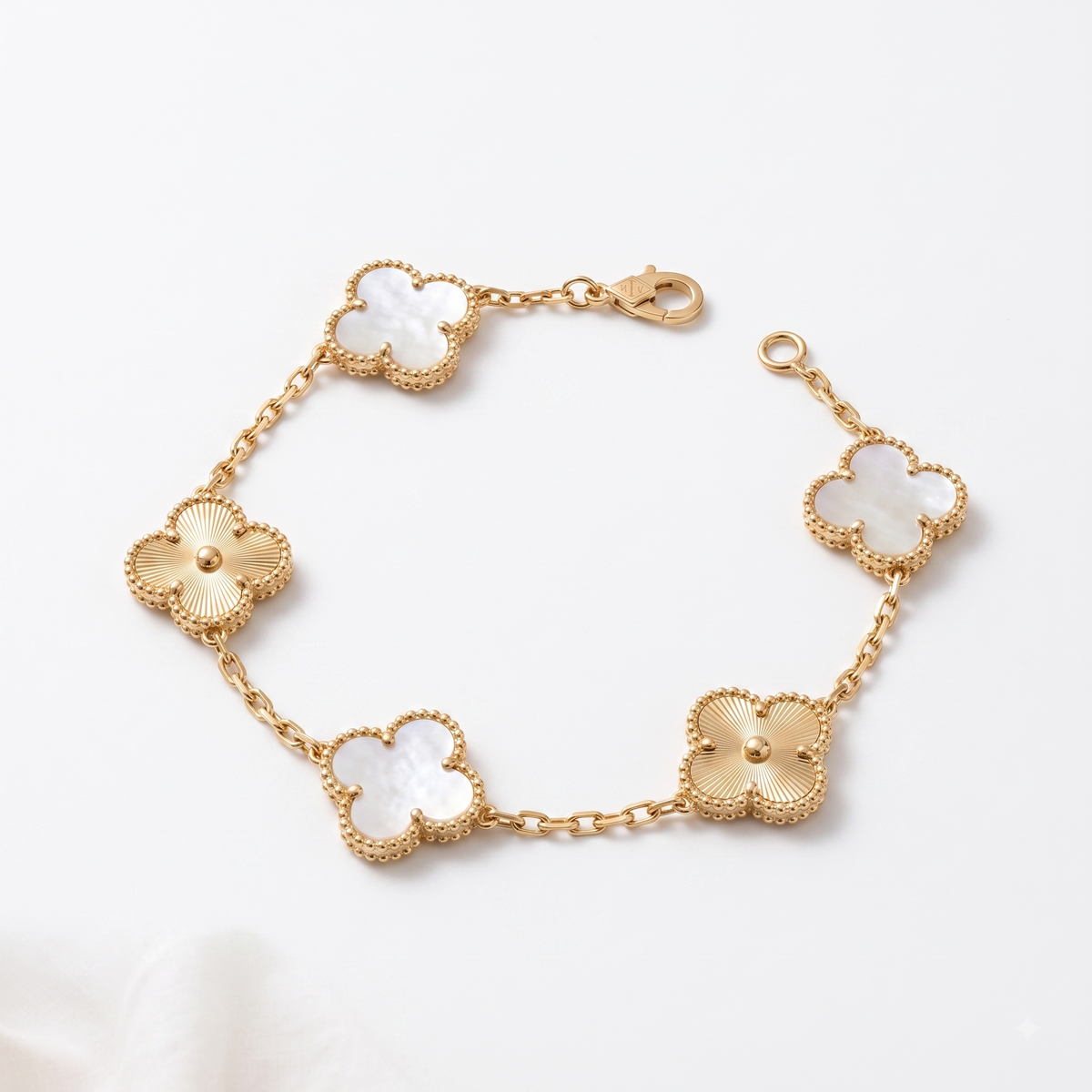 White & gold mother-of-pearl Lucky Clover Station Bracelet, close-up product shot